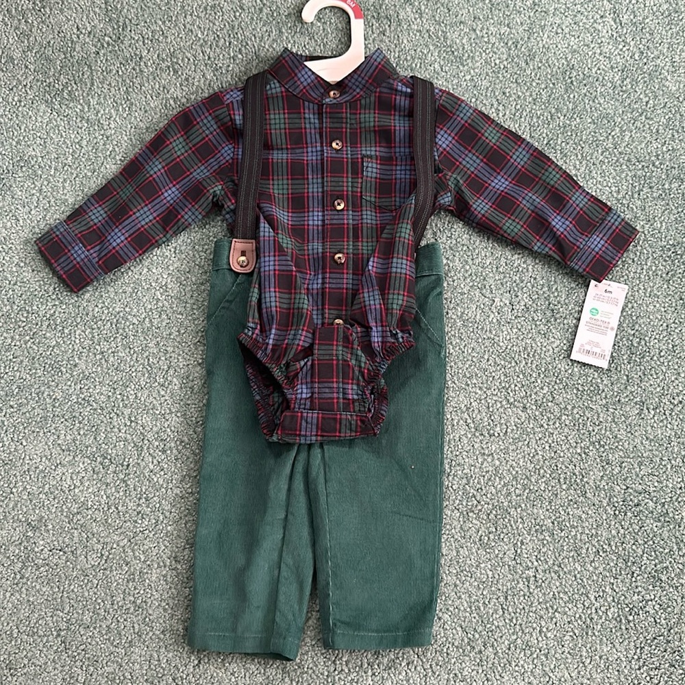 Never worn with tags. Plaid top with corduroy pants and suspenders. 6 months